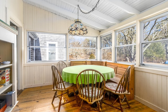 sunroom / solarium with vaulted ceiling with beams and wood ceiling