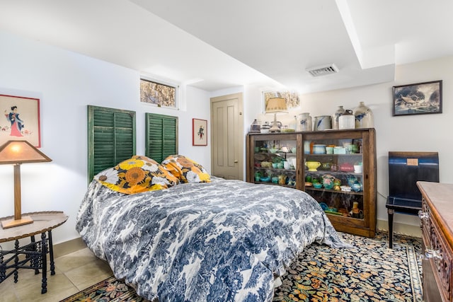 bedroom with visible vents and light tile patterned flooring