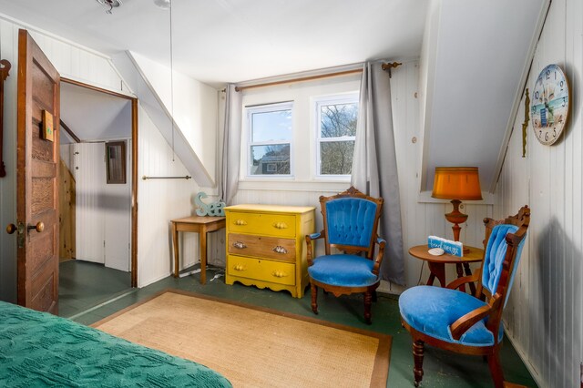 bedroom featuring concrete flooring