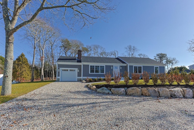 ranch-style house featuring a garage