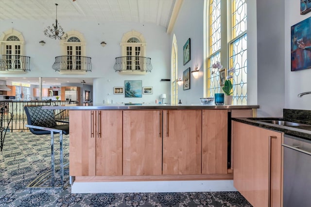 143 Main St, Sandwich, MA 02563 - interior space with dishwasher, a sink, carpet floors, brown cabinetry, and high vaulted ceiling