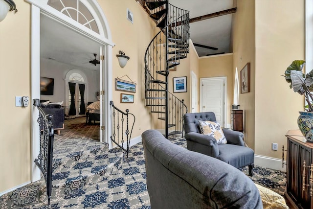 143 Main St, Sandwich, MA 02563 - interior space with stairway, visible vents, carpet, baseboards, and a towering ceiling