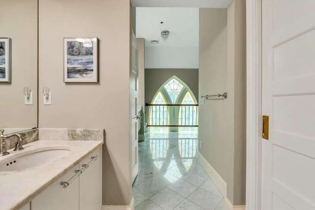 143 Main St, Sandwich, MA 02563 - bathroom featuring vanity, marble finish floor, baseboards, and visible vents