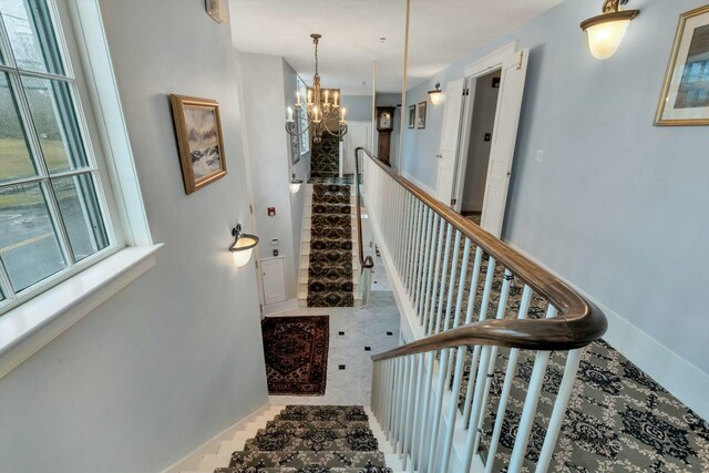 143 Main St, Sandwich, MA 02563 - stairs with a notable chandelier