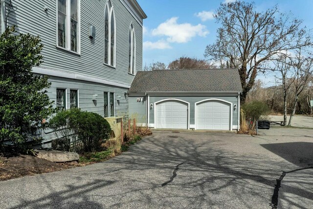 143 Main St, Sandwich, MA 02563 - view of side of property with a garage and aphalt driveway
