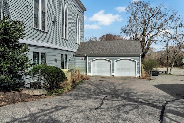 143 Main St, Sandwich, MA 02563 - view of side of home featuring aphalt driveway and a garage