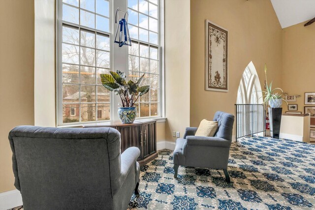 143 Main St, Sandwich, MA 02563 - living area featuring high vaulted ceiling and baseboards