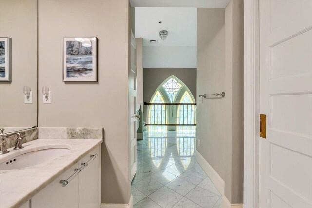 143 Main St, Sandwich, MA 02563 - bathroom featuring baseboards, visible vents, and vanity