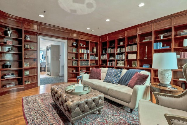 143 Main St, Sandwich, MA 02563 - sitting room featuring wood finished floors, recessed lighting, and built in shelves
