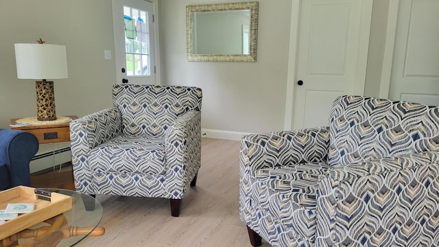 2-A Bodfish Ave, Sandwich, MA 02563 - living area featuring wood finished floors and a baseboard heating unit