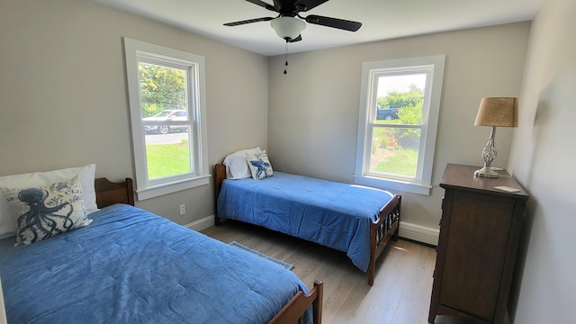 2-A Bodfish Ave, Sandwich, MA 02563 - bedroom with multiple windows, light wood finished floors, and a ceiling fan