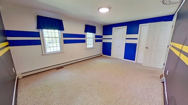 91 Hitching Post Ln, Centerville, MA 02632 - unfurnished bedroom with carpet, a baseboard heating unit, baseboards, and two closets