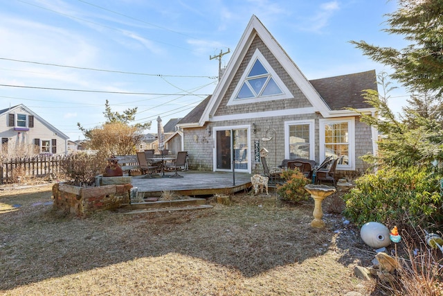 rear view of house featuring a deck