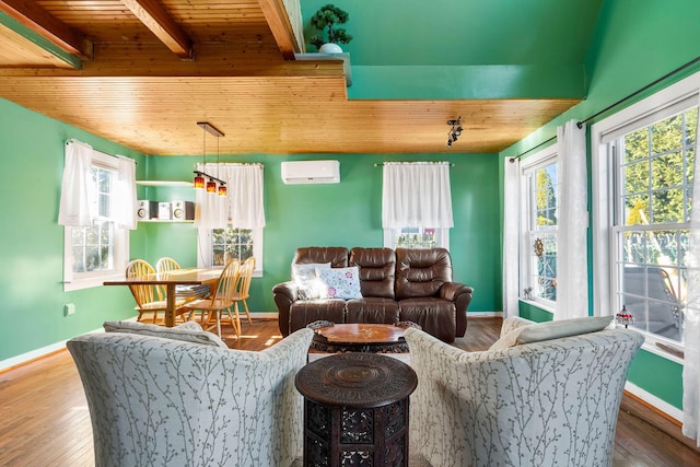 living room featuring hardwood / wood-style flooring, a healthy amount of sunlight, wooden ceiling, and a wall unit AC