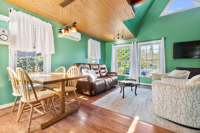 dining space with wood-type flooring, wooden ceiling, a wall unit AC, and lofted ceiling