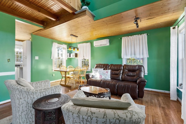 living room featuring an AC wall unit, wooden ceiling, wood-type flooring, and beamed ceiling