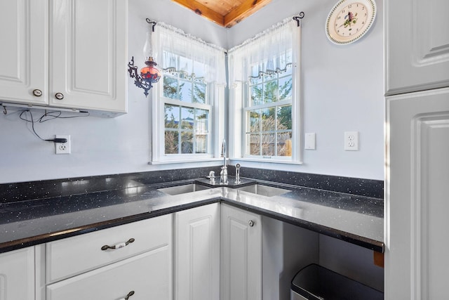 kitchen with sink and white cabinetry