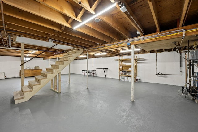 unfinished below grade area featuring stairs
