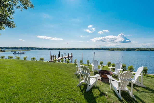 view of water feature with a boat dock and a fire pit