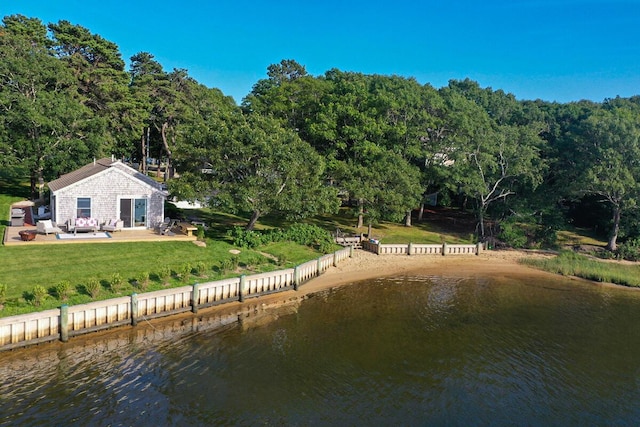 dock area featuring a water view and a lawn