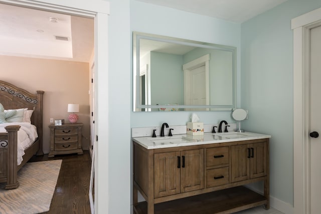 79 Neshobe Rd, Mashpee, MA 02649 - ensuite bathroom featuring double vanity and wood finished floors