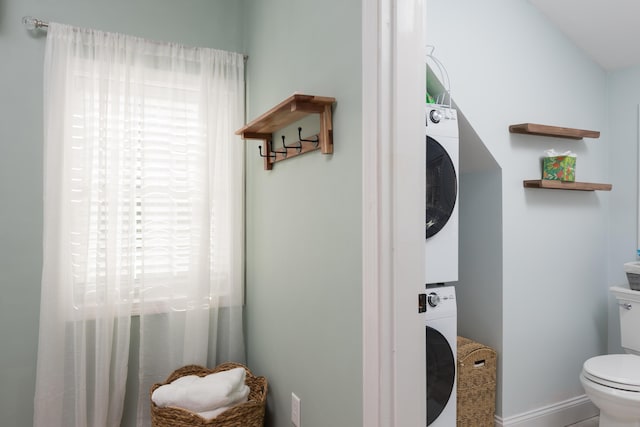 79 Neshobe Rd, Mashpee, MA 02649 - bathroom featuring stacked washer / dryer and toilet