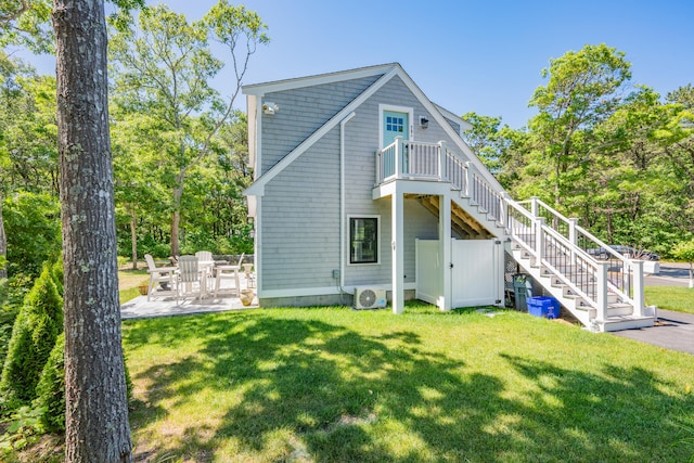 79 Neshobe Rd, Mashpee, MA 02649 - rear view of property featuring stairs, a yard, and a patio area