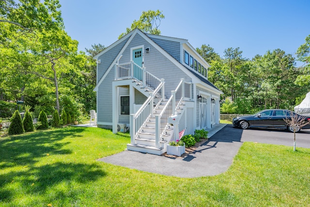 79 Neshobe Rd, Mashpee, MA 02649 - view of front facade with stairway and a front yard