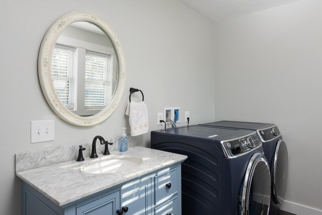 79 Neshobe Rd, Mashpee, MA 02649 - washroom with washing machine and clothes dryer and cabinet space
