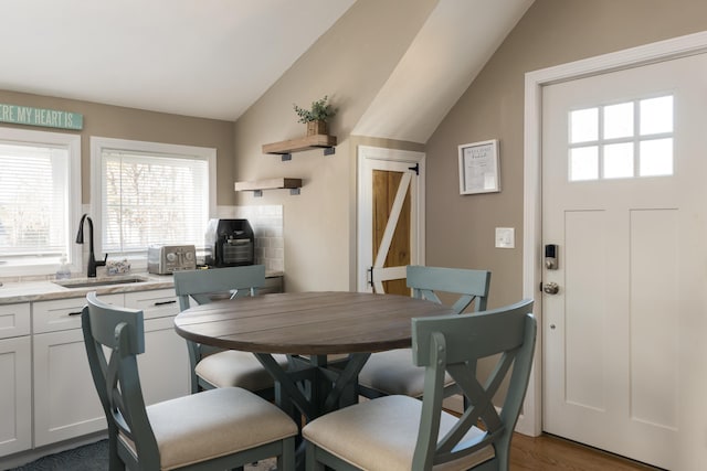 79 Neshobe Rd, Mashpee, MA 02649 - dining room featuring lofted ceiling, healthy amount of natural light, and wood finished floors
