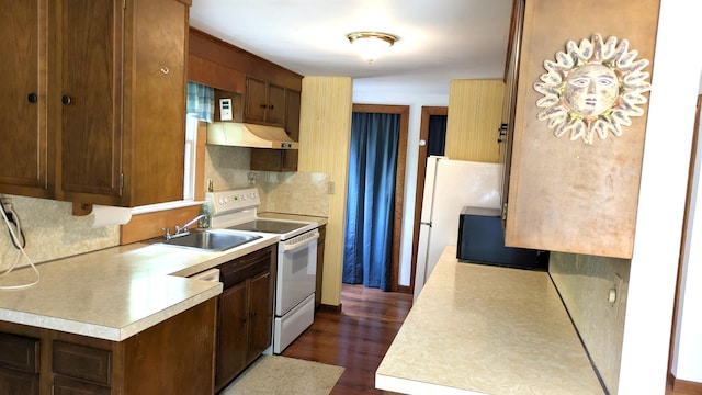 13 Pilgrim Ln, Eastham, MA 02642 - kitchen featuring white appliances, a sink, under cabinet range hood, and light countertops