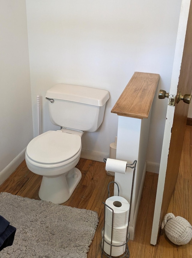 13 Pilgrim Ln, Eastham, MA 02642 - bathroom with baseboards, wood finished floors, and toilet