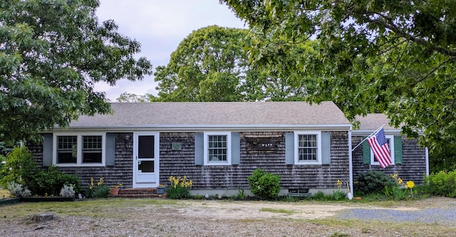 13 Pilgrim Ln, Eastham, MA 02642 - view of front of house featuring entry steps and roof with shingles