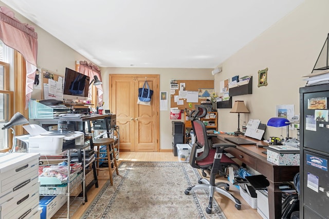 home office with wood finished floors