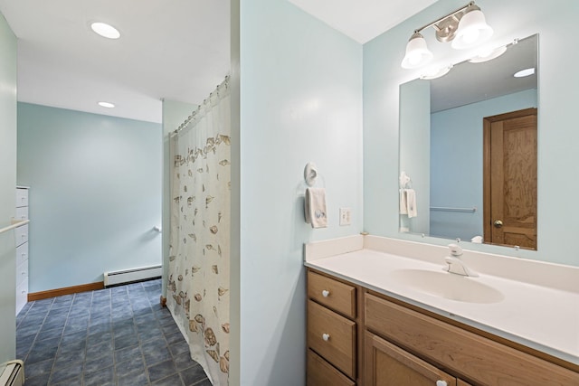 bathroom featuring vanity, baseboards, recessed lighting, and baseboard heating