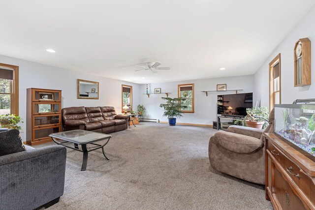 carpeted living room featuring a ceiling fan, baseboards, a healthy amount of sunlight, and recessed lighting