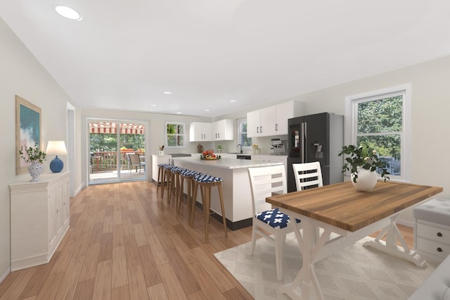 interior space with light wood-style flooring and recessed lighting