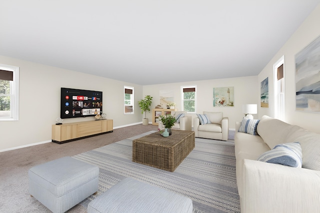 carpeted living room featuring baseboards