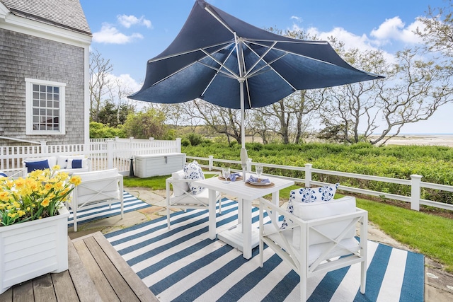 wooden deck featuring outdoor dining area