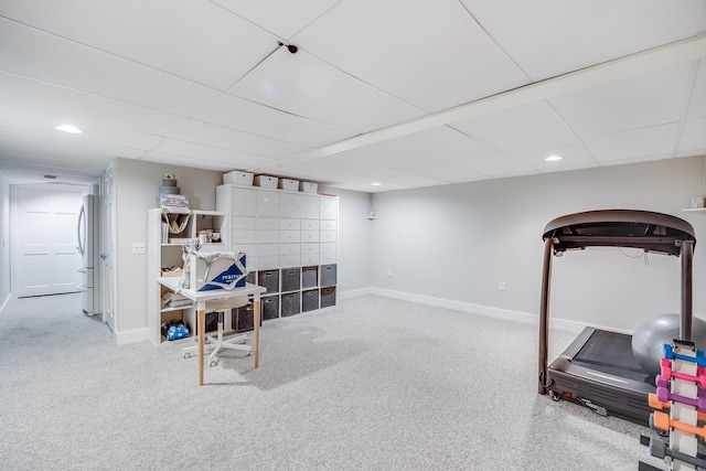 exercise area featuring baseboards, carpet, recessed lighting, and a paneled ceiling