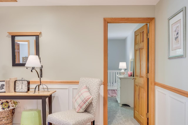 hallway featuring light colored carpet