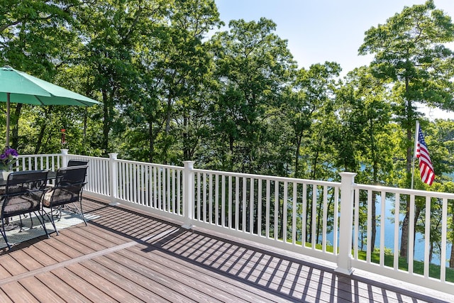 wooden deck featuring a water view