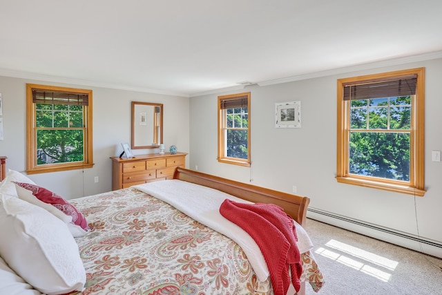 carpeted bedroom with a baseboard radiator and ornamental molding