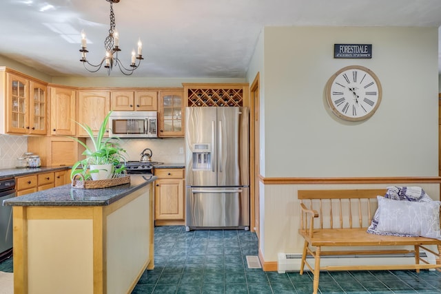 kitchen with stainless steel appliances, a center island, tasteful backsplash, a baseboard radiator, and light brown cabinets