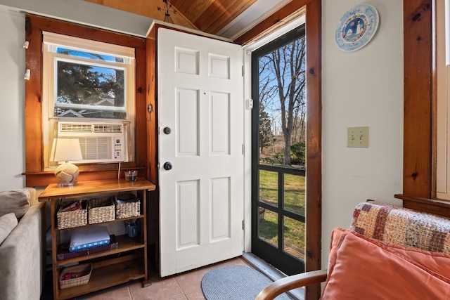 doorway to outside featuring cooling unit, wooden ceiling, tile patterned flooring, and vaulted ceiling