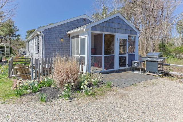 82 Shore Rd Unit 6, Truro, MA 02666 - rear view of property featuring a sunroom