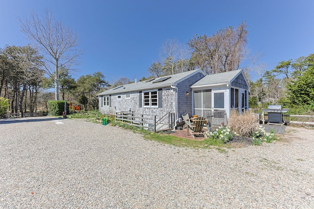 82 Shore Rd Unit 6, Truro, MA 02666 - exterior space with a sunroom and solar panels