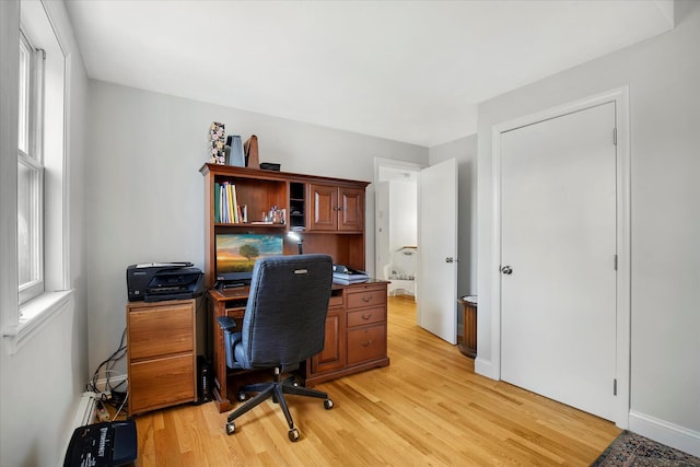 office area with light wood-style floors