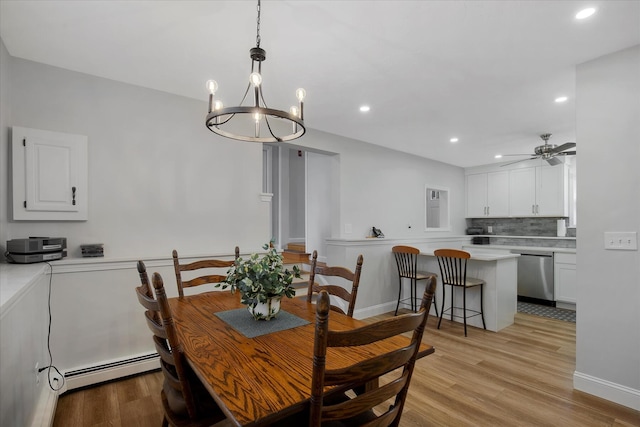 dining room featuring recessed lighting, light wood-style flooring, baseboard heating, a ceiling fan, and baseboards