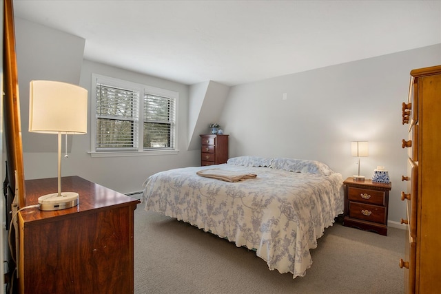 bedroom with carpet floors and baseboard heating